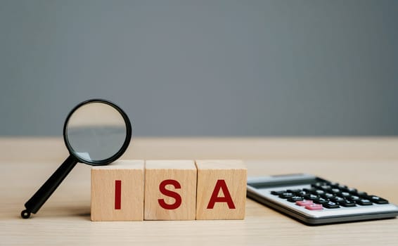 ISA - Individual Savings Account on a wooden blocks. Class of retail investment arrangement available to residents of the United Kingdom. Business and finance concept