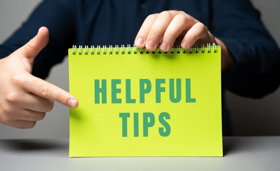 Helpful tips on notes in male hands. Business concept. Strategy, plan, planning. useful tips