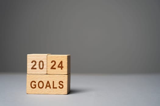 2024 goals concept. Planning strategy, plans and tasks. New business ideas. Setting goal, target. Motivation, inspiration. The inscription on wooden blocks