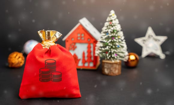 Money bag on the background of a Christmas tree, house and snow. Accumulating money and planning a budget. Business and finance. Loans, deposit, credit. Promotional, offers. Xmas winter holiday