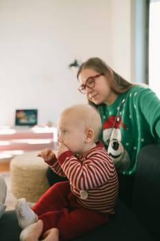 A warm bonding scene shows a child and an adult sharing joyful and affectionate moments in a festive setting