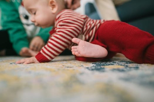 A baby crawls happily on a colorful rug, surrounded by family, capturing joyful moments of exploration and play
