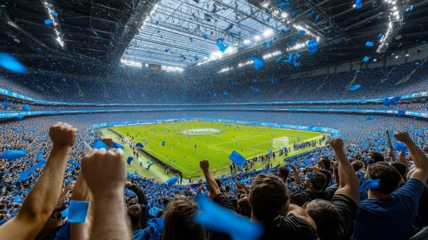 Soccer fans celebrating a goal in a crowded stadium full of blue confetti