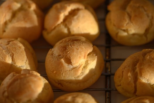 Delicious golden pastries rest on a wire rack, their inviting aroma filling the air of the cozy kitchen.