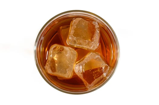 A cool beverage rests in a glass, perfectly chilled with ice cubes, inviting relaxation and enjoyment on a sunny day.