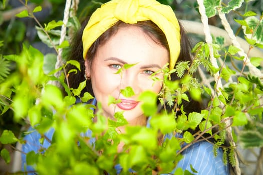A passionate gardener cares for blooming flowers surrounded by fresh green plants.