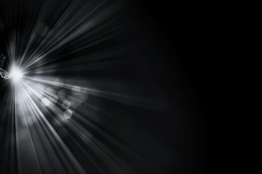 Abstract light burst on dark background with glowing rays and particles.