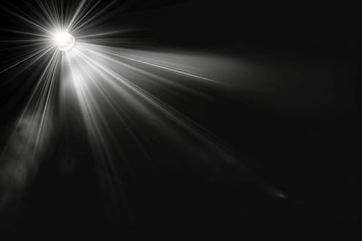 Bright spotlight illuminating darkness with radiating light beams.