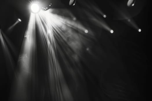 Dramatic stage lighting with intense beams and shadows.