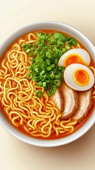 Steaming hot bowl of ramen with sliced pork, boiled eggs, and chopped green onions in a rich broth
