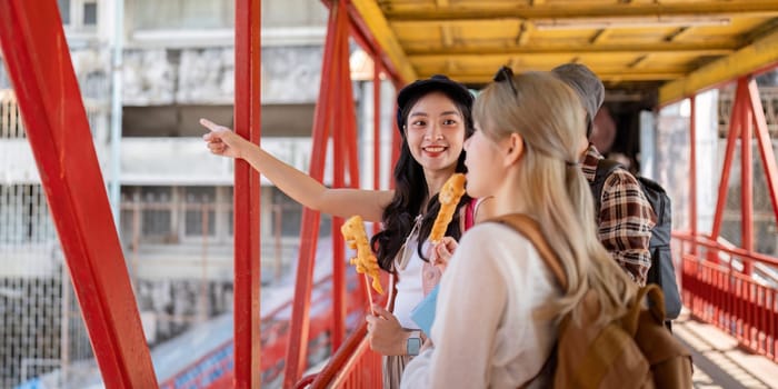 A diverse group of friends savoring street food on a lively bridge, sharing joyful moments while exploring the city together.