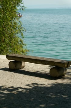 Idyllically situated bench on the island of Mainau on the shores of Lake Constance in Germany