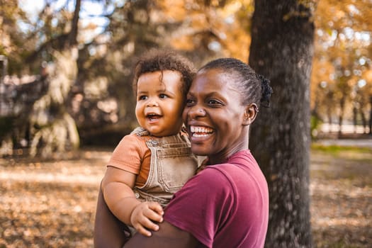 Mother's Embrace: Joyful Moments in the Park.