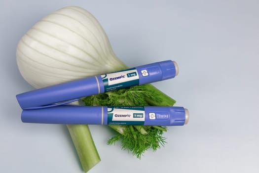 Ozempic Insulin injection pen and fennel vegetable root for diabetics and weight loss. Copenhagen, Denmark - January 31, 2025