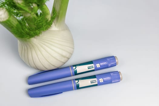 Ozempic Insulin injection pen and fennel vegetable root for diabetics and weight loss. High quality photo
