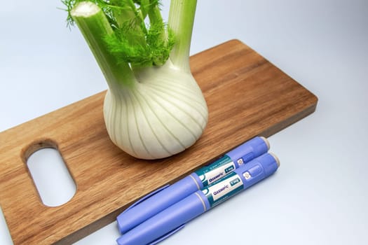 Ozempic Insulin injection pen and fennel vegetable root for diabetics and weight loss. Copenhagen, Denmark - January 31, 2025