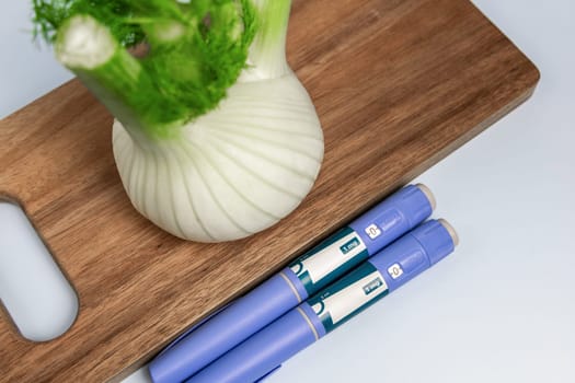 Ozempic Insulin injection pen and fennel vegetable root for diabetics and weight loss. High quality photo
