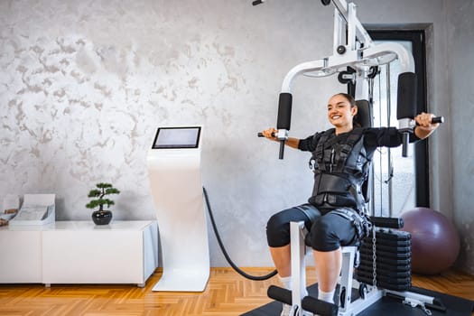 Person uses innovative tech in a dynamic strength training session.