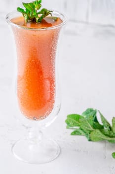 Vibrant Jamaican Me Crazy cocktail in hurricane glass, mint garnish for refreshing twist