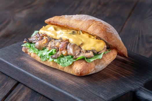 Delicious vegetarian sandwich with toasted ciabatta, fried oyster mushrooms, and yellow sauce