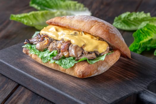 Delicious vegetarian sandwich with toasted ciabatta, fried oyster mushrooms, and yellow sauce