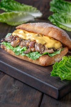 Delicious vegetarian sandwich with toasted ciabatta, fried oyster mushrooms, and yellow sauce