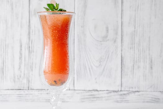Vibrant Jamaican Me Crazy cocktail in hurricane glass, mint garnish for refreshing twist