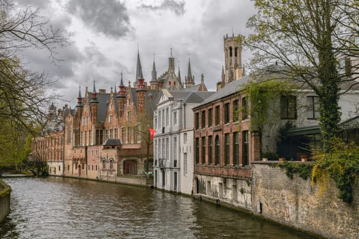 Bridge, canal and old houses in Brugge.