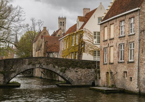 Bridge, canal and old houses in Brugge.