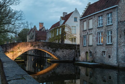 Bridge, canal and old houses in Brugge.