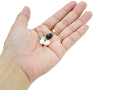 A hand with a pill on it, with clipping path