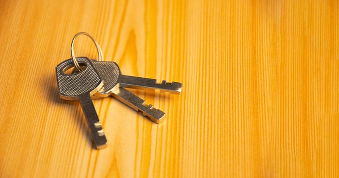 The key is on the wooden floor.