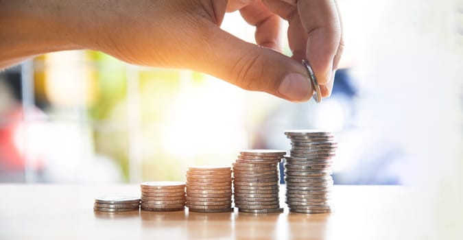 Coins are stacked in layers. from small to large money growth concept, business profit