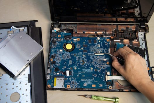 top view, mechanic repairing laptop computer