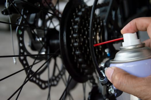 Bicycle gear lubricant spray to prevent rust and reduce humidity.