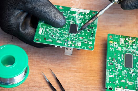 Motherboard repair parts soldering male close-up