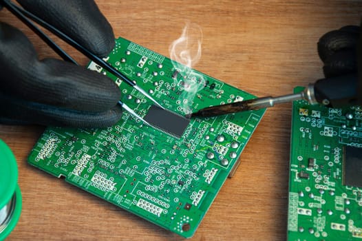 Motherboard repair parts soldering male close-up