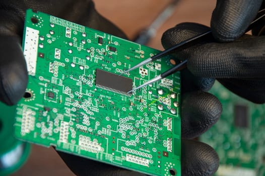 Motherboard repair parts soldering male close-up
