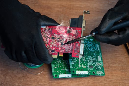 Motherboard repair parts soldering male close-up