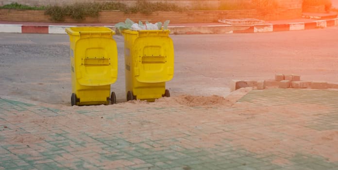 Yellow trash can in the park