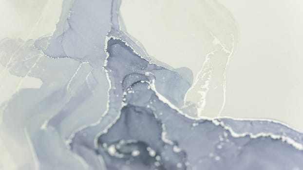 Beautiful alcohol ink artwork showcases flowing patterns, blending shades of grey and white. The intricate design highlights the unique textures and delicate nature of this artistic medium.