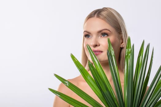A serene portrait elegantly showcasing a beautiful woman against a stunning backdrop of lush greenery
