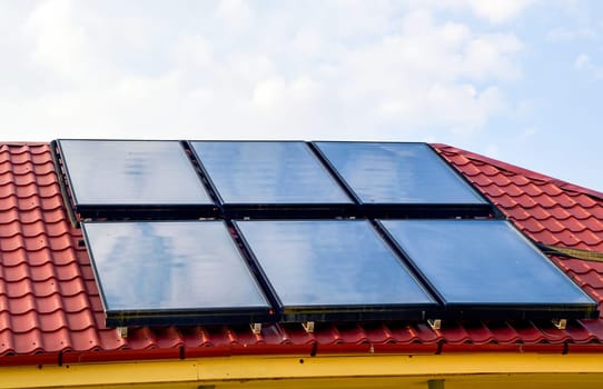 Six solar panels on the roof of the house