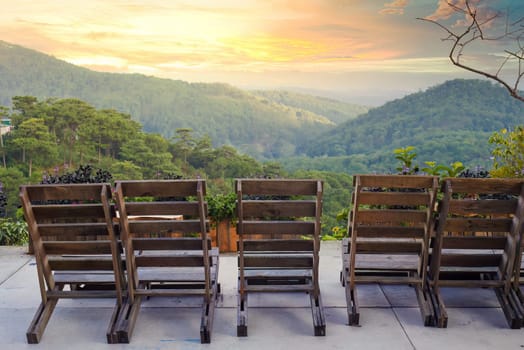 Many chairs under sunset against mountain view in Da Lat Vietnam