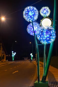 luminous dandelions on Da Lat street at night preparing the city for the flower festival