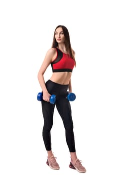 Beautiful fitness model exercising with dumbbells isolated full-length view