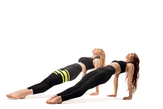 Slim models doing fitness isolated full-length shot