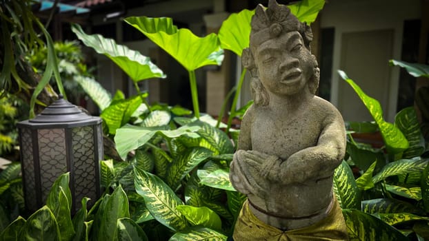 Garden Gnome traditional stone statue situated in a tranquil tropical garden, surrounded by vibrant foliage and artistic decor, harmonizing with the natural beauty of its environment. Good for Background