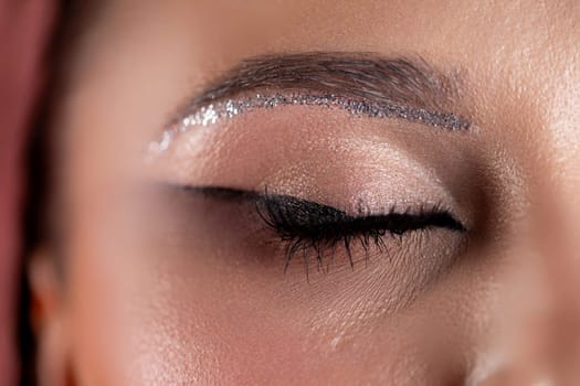 A breathtaking closeup image of eye makeup that beautifully showcases shimmering details and elegant artistry