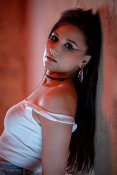 A stunning portrait of a fashionable young woman exuding confidence and trendiness in her appearance
